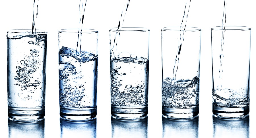 bigstock-five-water-glasses-being-fille-22447346