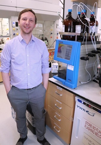 biotage-pps507-figure3-Dr.-Aaron-Muth-next-to-IsoleraTM